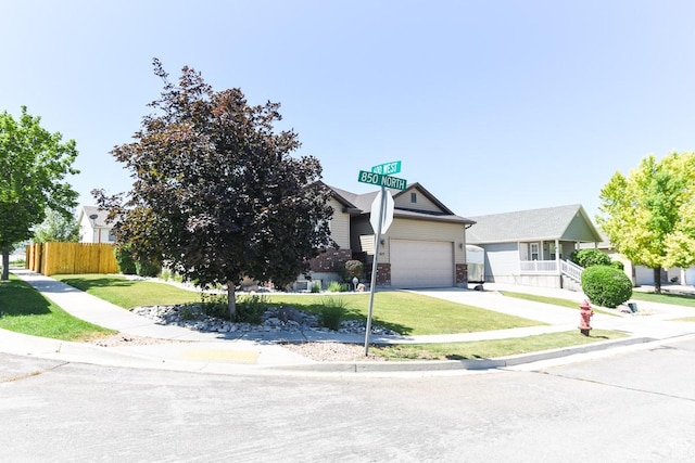615 W 850 N, Tooele, UT 84074 - view of property hidden behind natural elements with driveway and a garage