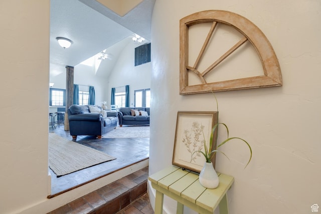 2599 S Foxridge Rd, Garden City, UT 84028 - hallway featuring high vaulted ceiling and a skylight