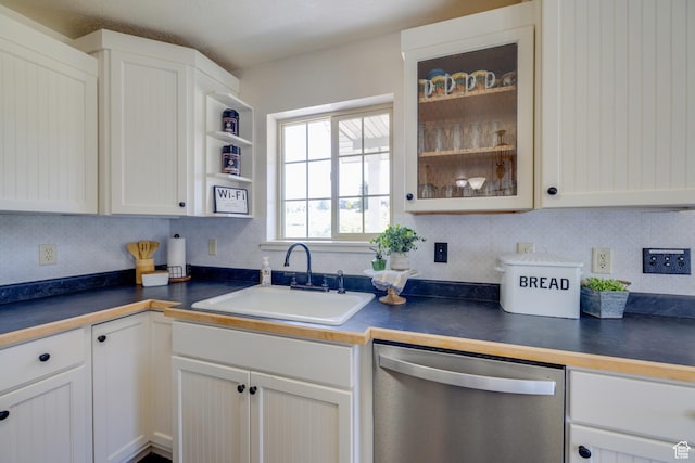 2599 S Foxridge Rd, Garden City, UT 84028 - kitchen with dishwasher, dark countertops, glass insert cabinets, and decorative backsplash