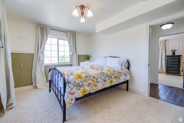 2599 S Foxridge Rd, Garden City, UT 84028 - carpeted bedroom featuring baseboards and a wainscoted wall