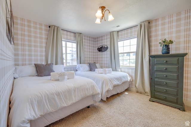 2599 S Foxridge Rd, Garden City, UT 84028 - bedroom with multiple windows, carpet, and wallpapered walls