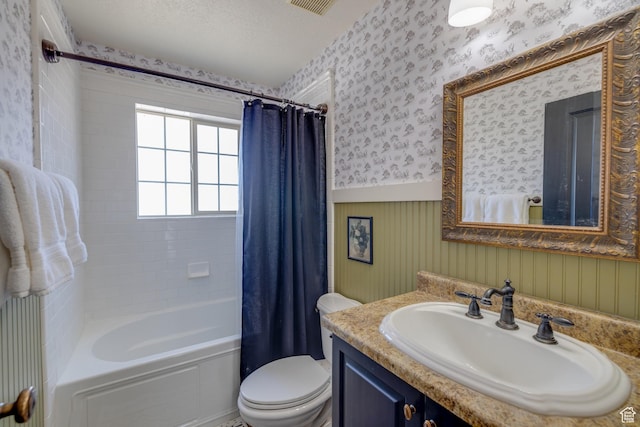 2599 S Foxridge Rd, Garden City, UT 84028 - bathroom featuring wallpapered walls, wainscoting, vanity, and shower / tub combo with curtain