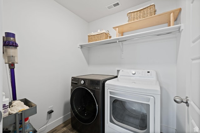 4892 E Lake Corner Dr, Eagle Mountain, UT 84005 - laundry room with washing machine and dryer and dark wood-style floors