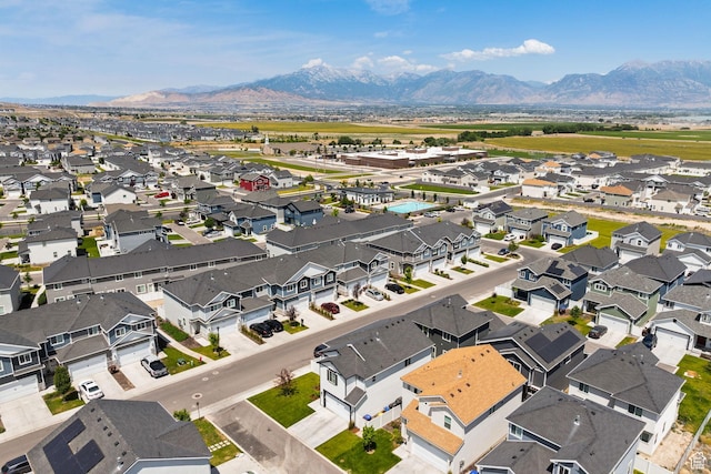 4892 E Lake Corner Dr, Eagle Mountain, UT 84005 - aerial view of residential area featuring a mountainous background