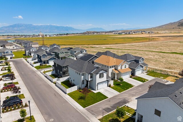 4892 E Lake Corner Dr, Eagle Mountain, UT 84005 - aerial perspective of suburban area with a mountain backdrop