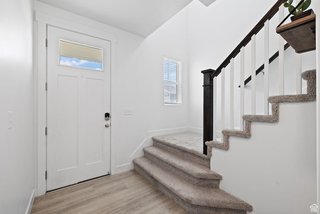 4892 E Lake Corner Dr, Eagle Mountain, UT 84005 - foyer entrance with stairway and light wood-type flooring