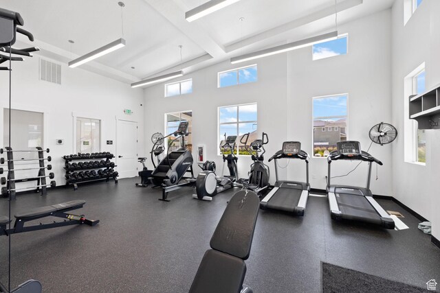 4892 E Lake Corner Dr, Eagle Mountain, UT 84005 - workout area with a towering ceiling, healthy amount of natural light, and beam ceiling