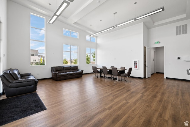 4892 E Lake Corner Dr, Eagle Mountain, UT 84005 - living room featuring a towering ceiling and wood finished floors