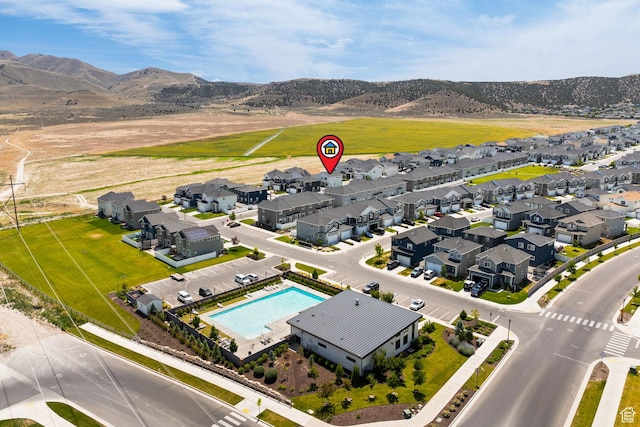 4892 E Lake Corner Dr, Eagle Mountain, UT 84005 - aerial perspective of suburban area featuring a mountainous background and a pool
