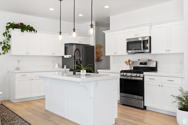 4892 E Lake Corner Dr, Eagle Mountain, UT 84005 - kitchen with appliances with stainless steel finishes, light countertops, a breakfast bar area, light wood-type flooring, and recessed lighting