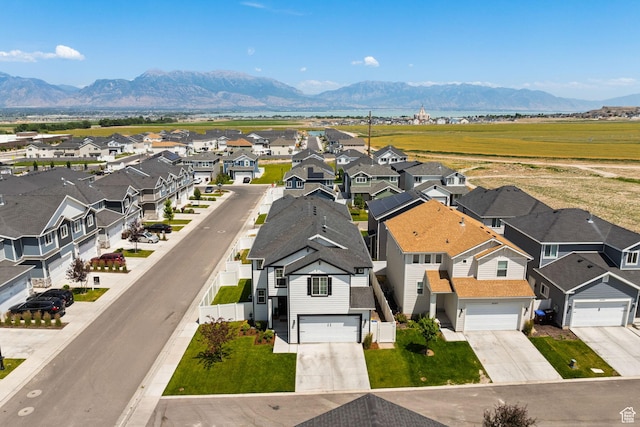 4892 E Lake Corner Dr, Eagle Mountain, UT 84005 - aerial view of residential area with a mountain backdrop