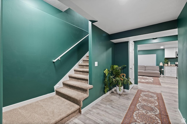 4892 E Lake Corner Dr, Eagle Mountain, UT 84005 - stairs featuring wood finished floors and baseboards