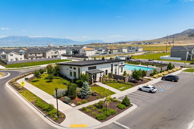 4892 E Lake Corner Dr, Eagle Mountain, UT 84005 - aerial perspective of suburban area featuring a mountain backdrop and a pool