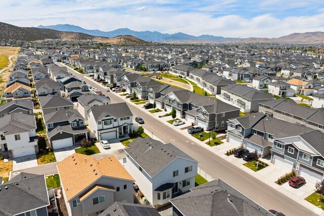 4892 E Lake Corner Dr, Eagle Mountain, UT 84005 - aerial view of residential area featuring a mountainous background