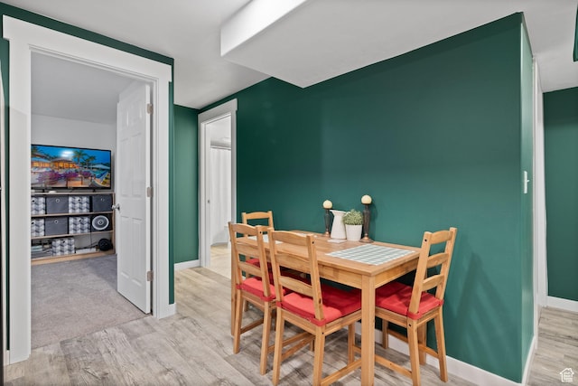 4892 E Lake Corner Dr, Eagle Mountain, UT 84005 - dining room featuring light wood-type flooring and baseboards