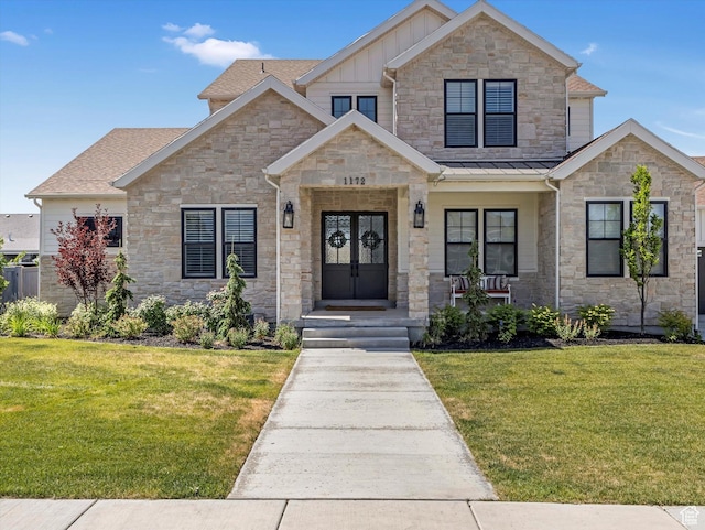 1172 E Candy Ln, American Fork, UT 84003 - craftsman inspired home featuring stone siding, a front yard, and board and batten siding