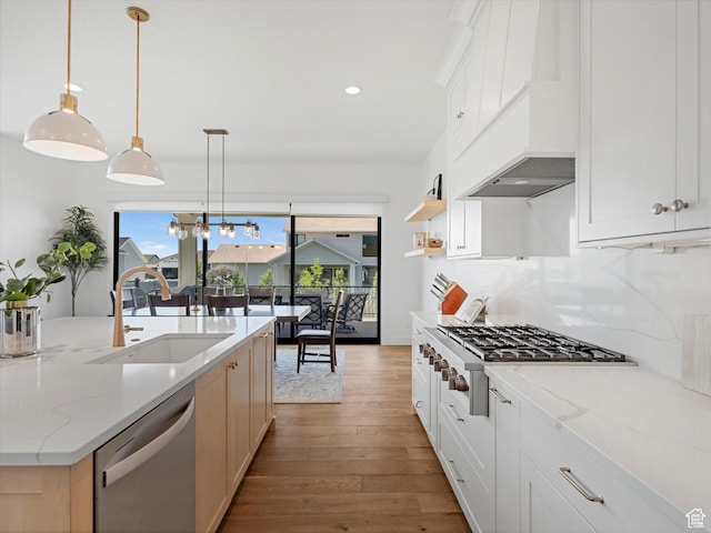1172 E Candy Ln, American Fork, UT 84003 - kitchen featuring stainless steel appliances, wood finished floors, premium range hood, recessed lighting, and hanging light fixtures