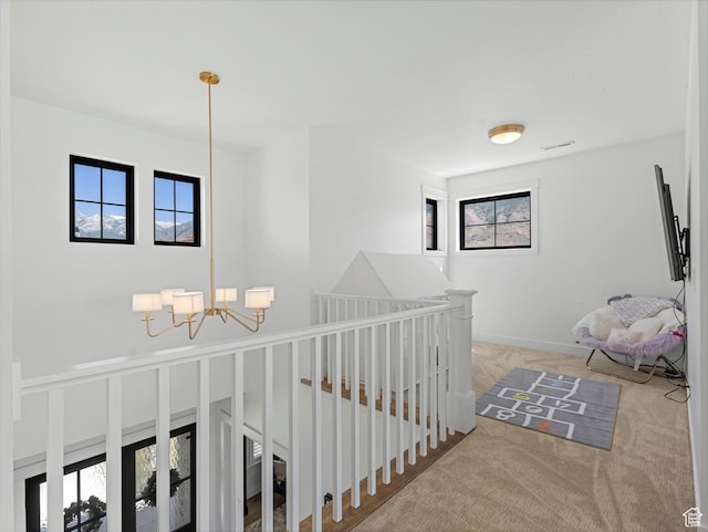 1172 E Candy Ln, American Fork, UT 84003 - hall featuring a chandelier, an upstairs landing, and carpet floors