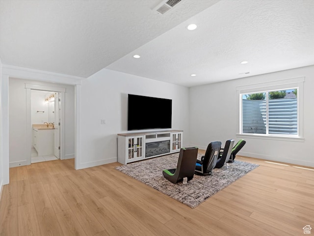 1172 E Candy Ln, American Fork, UT 84003 - living area with wood finished floors, recessed lighting, and a textured ceiling