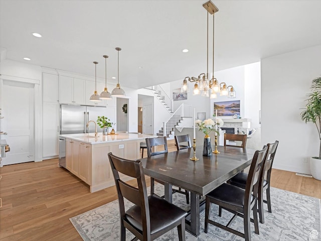 1172 E Candy Ln, American Fork, UT 84003 - dining area with light wood-style floors, stairway, recessed lighting, and a chandelier