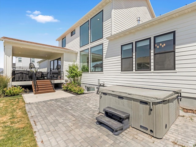 1172 E Candy Ln, American Fork, UT 84003 - view of patio / terrace featuring a hot tub and a wooden deck