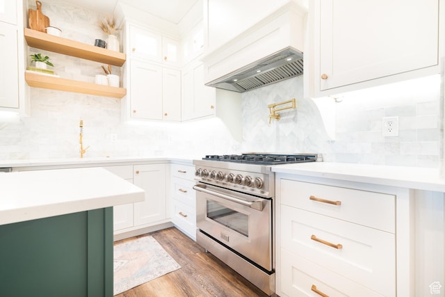 986 View Crest Ln, Kaysville, UT 84037 - kitchen with high end stainless steel range oven, backsplash, white cabinetry, and light wood finished floors