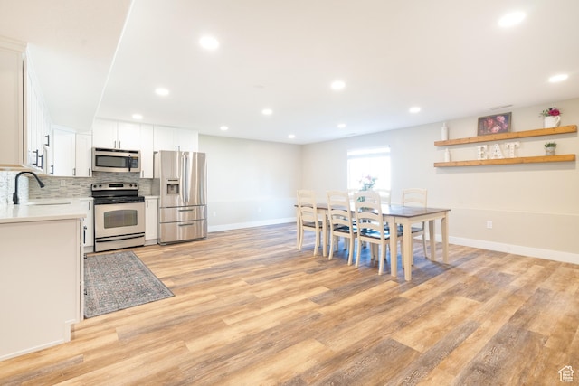 986 View Crest Ln, Kaysville, UT 84037 - dining room featuring light wood-style floors and recessed lighting