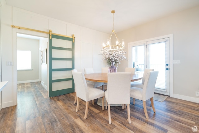 986 View Crest Ln, Kaysville, UT 84037 - dining room featuring a chandelier, dark wood-type flooring, healthy amount of natural light, and a barn door