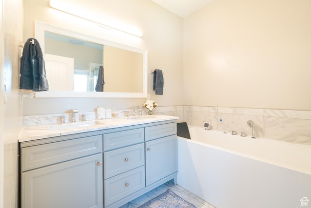 986 View Crest Ln, Kaysville, UT 84037 - bathroom with double vanity, a bath, and marble finish flooring
