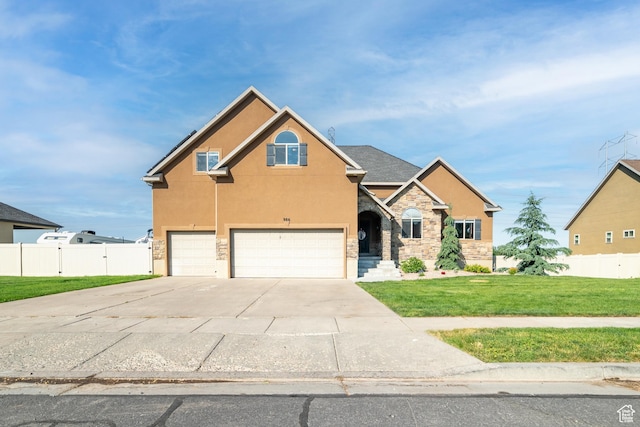986 View Crest Ln, Kaysville, UT 84037 - traditional-style house featuring an attached garage, stone siding, stucco siding, and driveway