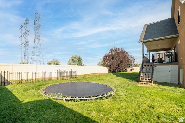 986 View Crest Ln, Kaysville, UT 84037 - fenced backyard featuring a trampoline, stairway, and a playground