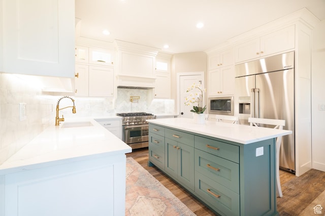 986 View Crest Ln, Kaysville, UT 84037 - kitchen featuring built in appliances, white cabinetry, wood finished floors, backsplash, and recessed lighting