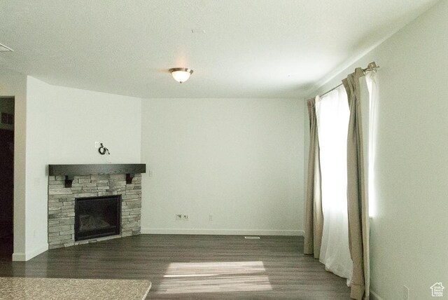63 N Canyon Maple Rd, Vineyard, UT 84059 - unfurnished living room featuring wood finished floors and a fireplace