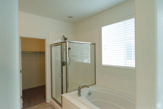 63 N Canyon Maple Rd, Vineyard, UT 84059 - full bathroom with a stall shower, a bath, and a spacious closet