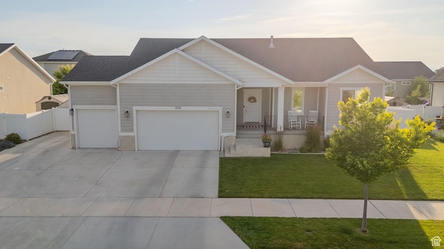 1752 S 570 W, Provo, UT 84601 - view of front facade featuring a porch, driveway, and an attached garage