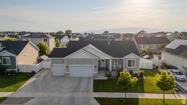 1752 S 570 W, Provo, UT 84601 - view of front facade with a residential view, driveway, an attached garage, and covered porch