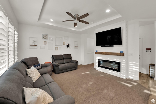 1752 S 570 W, Provo, UT 84601 - living area with a tray ceiling, ceiling fan, recessed lighting, a glass covered fireplace, and carpet floors