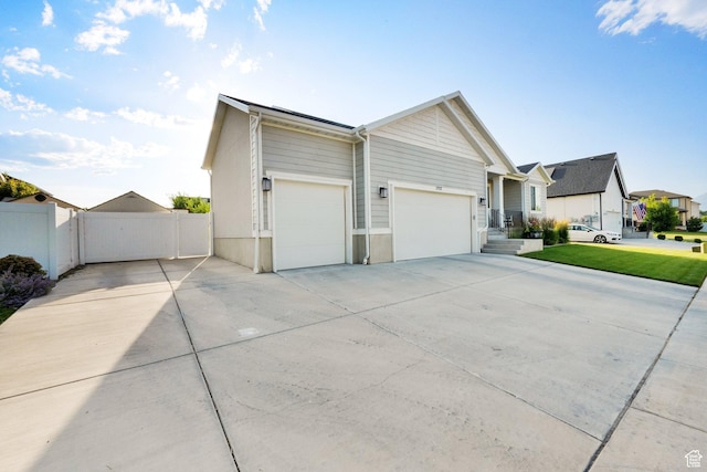 1752 S 570 W, Provo, UT 84601 - view of front facade featuring driveway, an attached garage, and a residential view