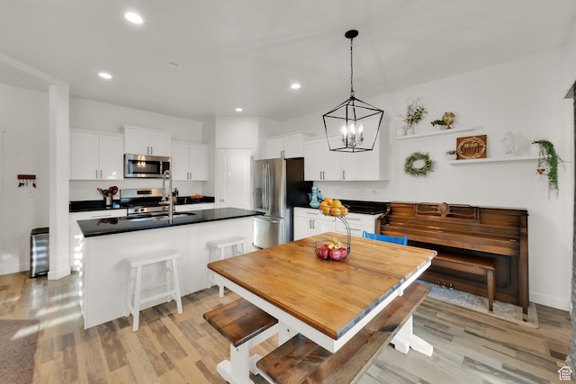 1752 S 570 W, Provo, UT 84601 - dining room with light wood-type flooring, recessed lighting, and a chandelier