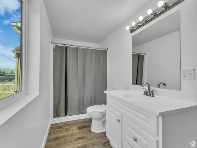 161 E 200 S, Tooele, UT 84074 - full bath with vanity, wood finished floors, a shower with shower curtain, and a textured ceiling