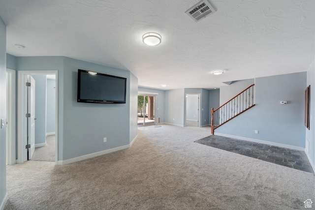 2752 E 50 S, St George, UT 84790 - unfurnished living room featuring carpet, stairs, and a textured ceiling