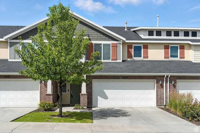5423 W Black Hills Ln, Herriman, UT 84096 - view of property with concrete driveway, an attached garage, brick siding, and roof with shingles
