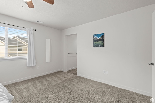 5423 W Black Hills Ln, Herriman, UT 84096 - unfurnished bedroom with carpet floors, a textured ceiling, and ceiling fan