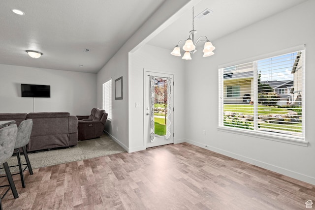 5423 W Black Hills Ln, Herriman, UT 84096 - dining area with a chandelier and wood finished floors
