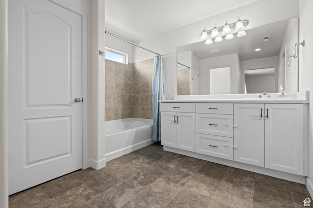 5423 W Black Hills Ln, Herriman, UT 84096 - full bath featuring vanity, shower / bath combo, and stone finish flooring