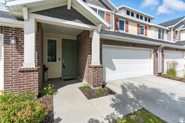 5423 W Black Hills Ln, Herriman, UT 84096 - property entrance with brick siding, concrete driveway, an attached garage, and roof with shingles