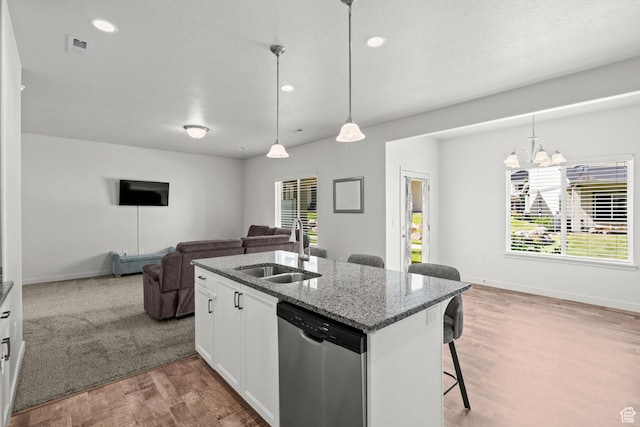 5423 W Black Hills Ln, Herriman, UT 84096 - kitchen with dishwasher, open floor plan, a kitchen breakfast bar, light wood finished floors, and stone countertops