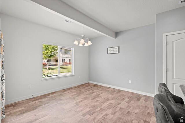 5423 W Black Hills Ln, Herriman, UT 84096 - empty room featuring a chandelier, light wood-style floors, and beamed ceiling