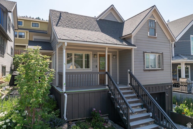 915 Norfolk Ave, Park City, UT 84060 - view of front facade with covered porch, a shingled roof, and stairs