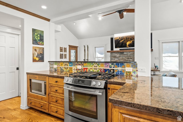 915 Norfolk Ave, Park City, UT 84060 - kitchen with stainless steel range with gas stovetop, built in microwave, plenty of natural light, brown cabinets, and recessed lighting